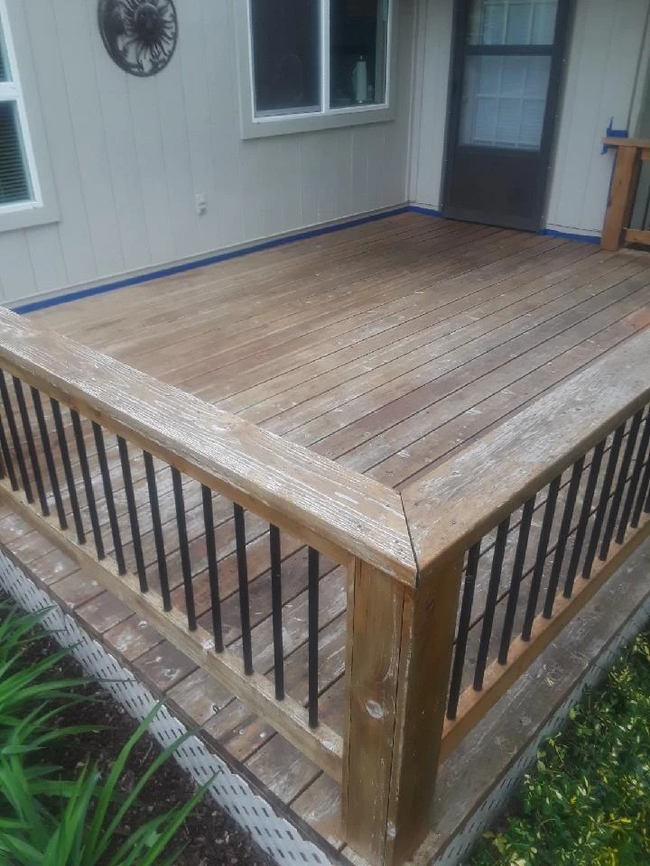 Weathered wood deck before cleaning and restoration