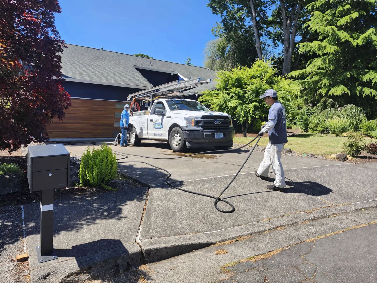 Crew performing post-job yard cleanup